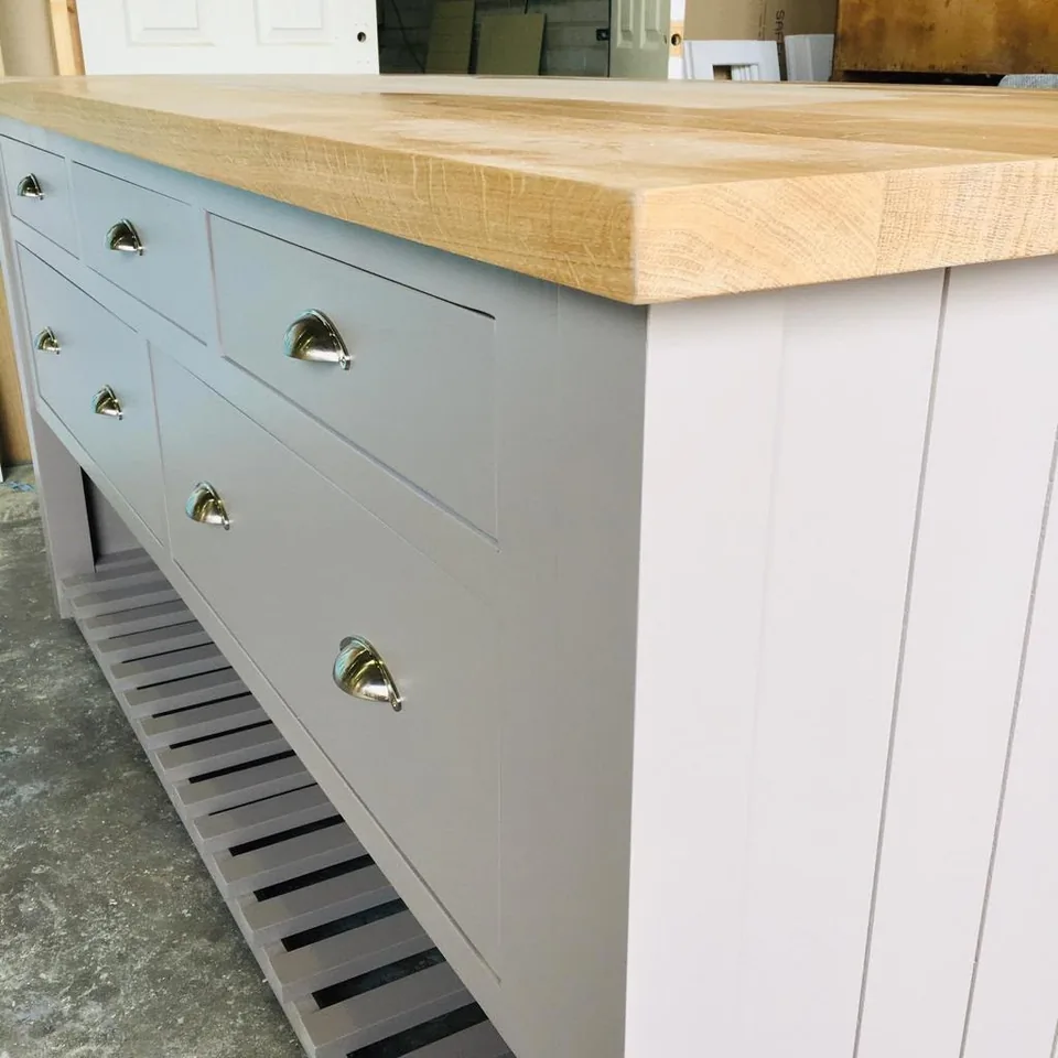 A Byron Range island with an oak top and a slatted shelf