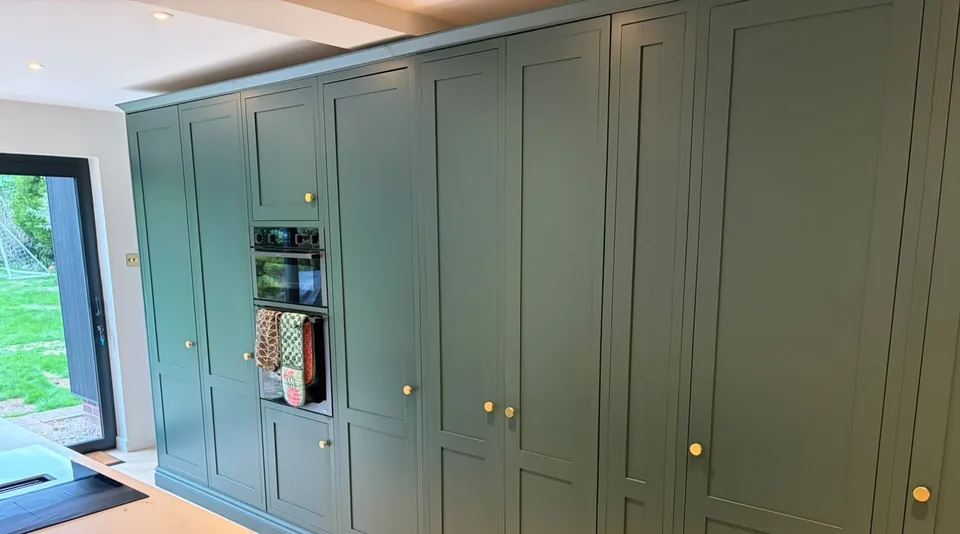 A wall of tall Byron Range cupboards around the ovens