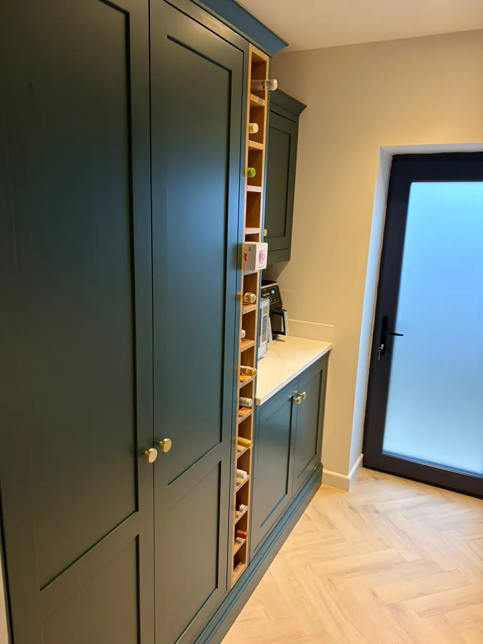 A tall Byron Range cupboard with a built-in wine rack