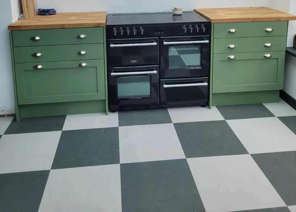 The Keats Range, painted green, around a range cooker